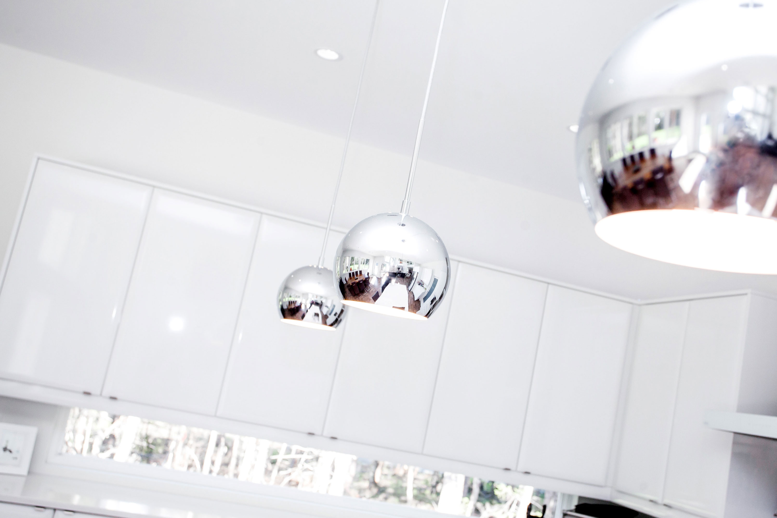 These adventurous pendant lights enliven a modern space.
